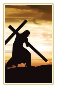 Silhouette of Jesus carrying the cross at sunset