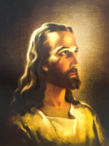 Portrait of Jesus Christ with radiant light symbolizing divine presence