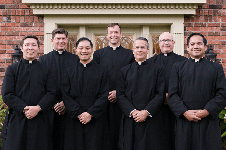 Legionaries of Christ priests standing together in community